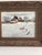 Original vintage oil painting on board depicting a rural farm in winter, with barns, outbuildings, snow-covered fields,...