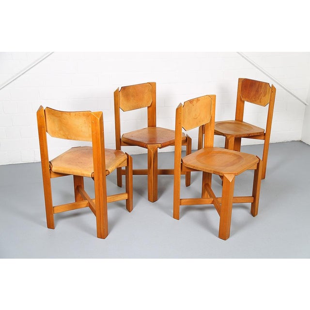 A set of four rare chairs reminiscent of designs by French designer Pierre Chapo or Maison Regain. The massive, heavy...