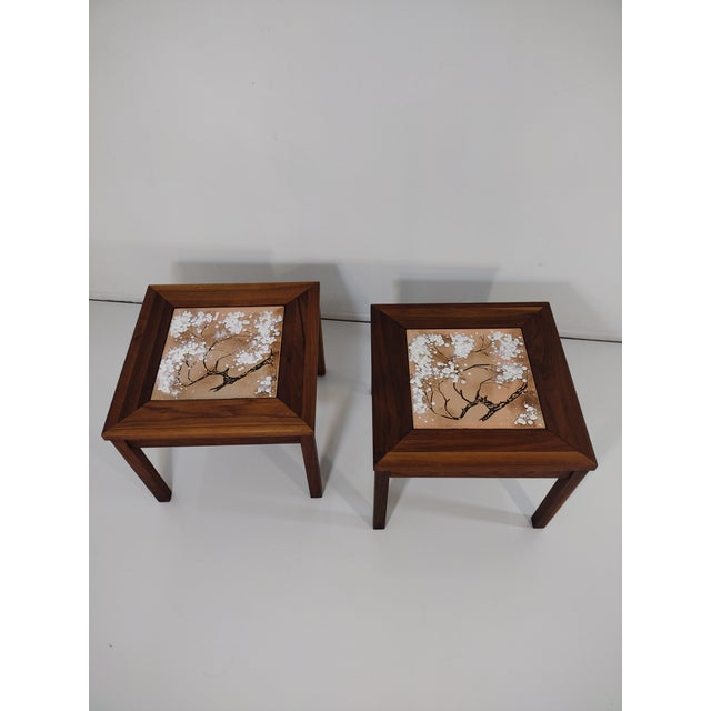 Pair of walnut end tables with a tile top Made by brown and Salman furniture company I believe they're designed by John...