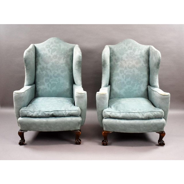 Pair of Early 20th Century Wingback Armchairs Item Code: EL12/775 A handsome pair of early 20th-century wingback...