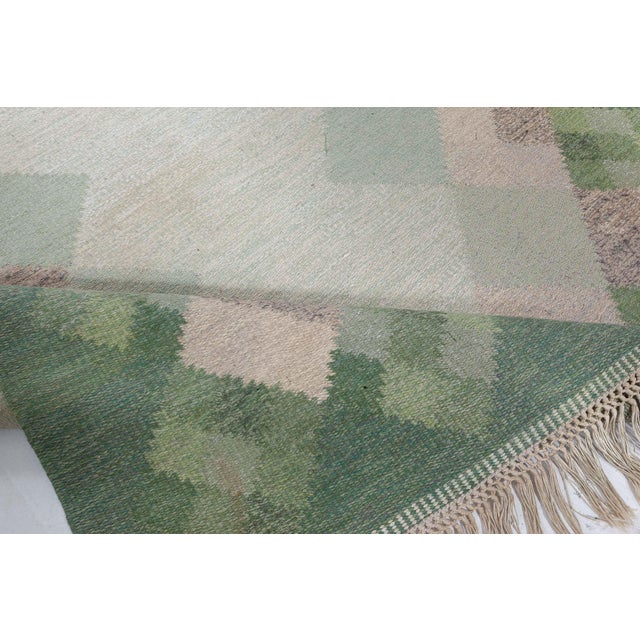 Midcentury Swedish flat woven rug by Ingegerd Silow Size: 5'4" × 7'7" (162 × 231 cm) A masterclass in modernist...