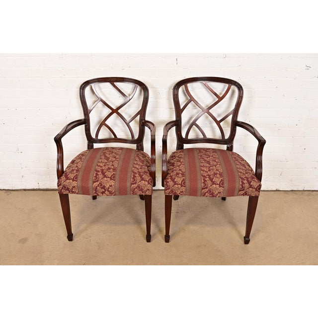 A gorgeous pair of Federal or Hepplewhite style armchairs or dining captain chairs By Kindel Furniture USA, Circa 1980s...
