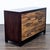 This dresser features a striking patchwork wood design on the drawer fronts, giving it a modern rustic look. It offers six...