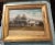 Antique painting of a white house on artist board in a Antique giltwood frame with square nails holding it in. Signed at...