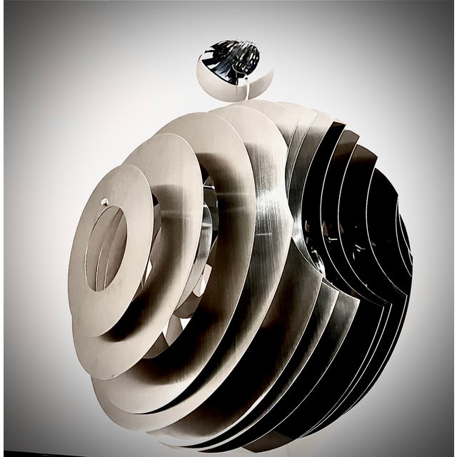 The Foscarini Supernova is a sculptural suspension lamp designed by Ferruccio Laviani. It features a spherical shape built...