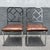 A striking pair of Mid Century Modern dining chairs featuring polished chrome frames with an elegant Chippendale-inspired...