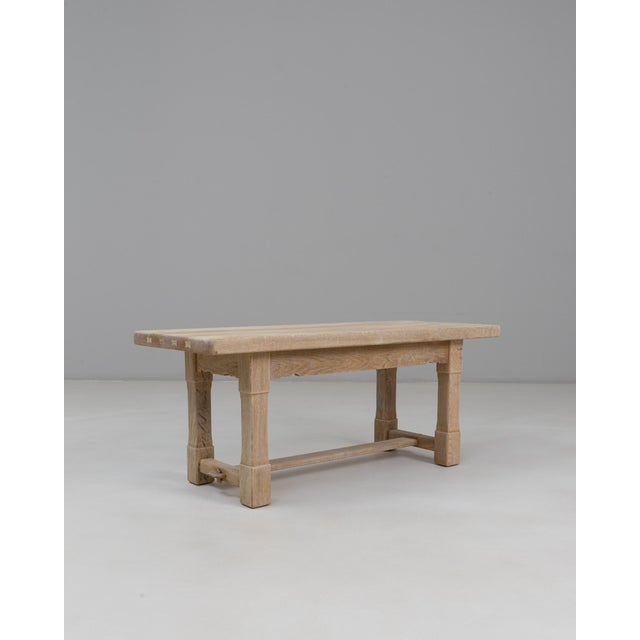 This 1970s French oak coffee table offers a clean, understated aesthetic rooted in traditional craftsmanship. The...