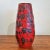 A wonderful black and red fat lava vase from Scheurich Keramik. At 14.75" tall, it is sure to make a statement on its own...