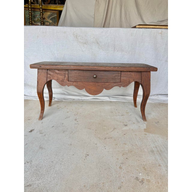 Found in the South of France, this 19th Century French Provincial Walnut Louis XV Style Bench was crafted in the late...