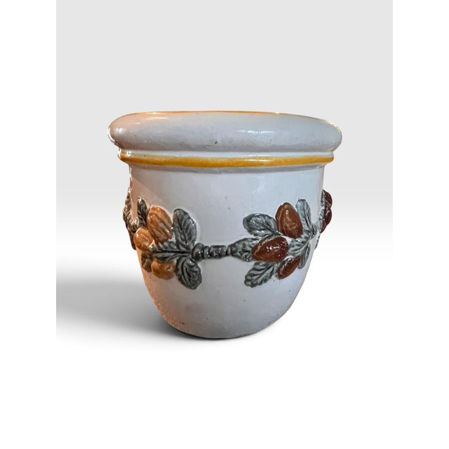 Beautiful large-scale handmade Italian ceramic planter featuring an elegant raised fruit-and-leaf garland encircling the...