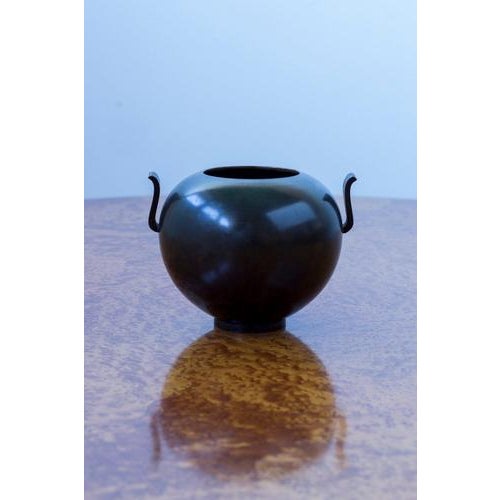 Bronze vase model 121 produced in stockholm by guldsmedsaktiebolaget, gab. Made in sweden in 1936. Spherical shape with a...
