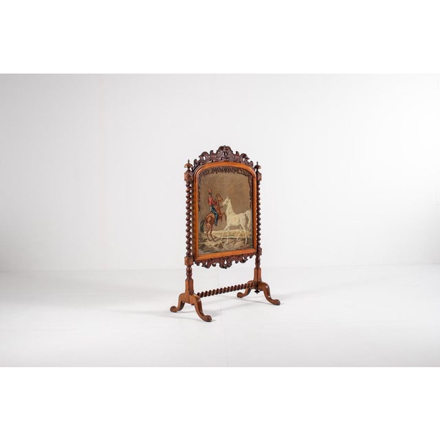 This 19-century Victorian fire screen is made of solid wood (most probably rosewood) and adorned with intricately carved...