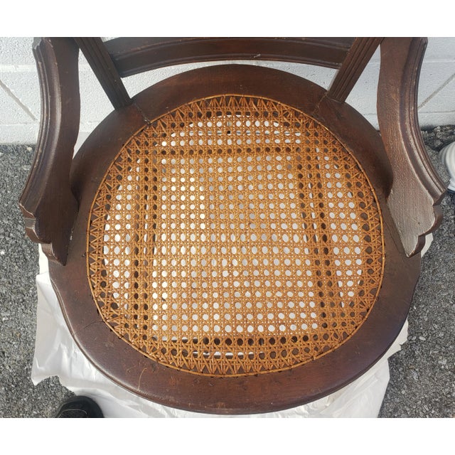 A Victorian Carved Walnut and Cane Seat Side Chair in good antique condition. Measures 19" in width, 19" in depth and...