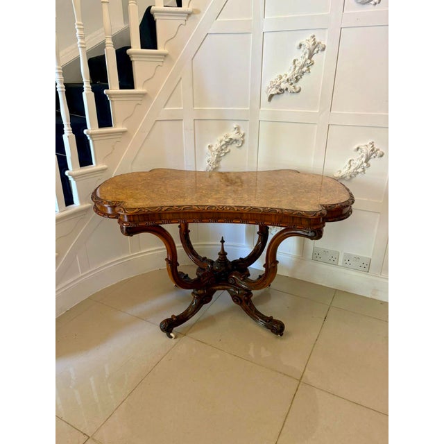 Outstanding quality antique Victorian carved burr walnut centre table having a magnificent quality serpentine shaped burr...