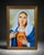 Framed religious portrait artwork featuring a classic devotional Sacred Heart style image with vivid blue, white, red, and...