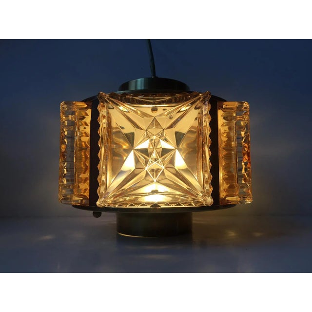 This pendant light was designed and manufactured by Danish design trio Vitrika in the 1960s. The name Vitrika, or Vi-Tri-...