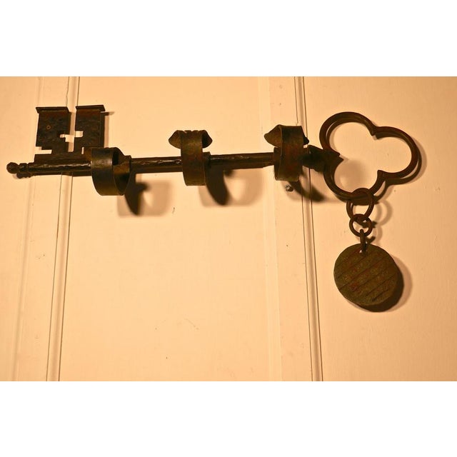 Blacksmith made French hat and coat rack, in the form of a giant key. This large quirky hat and coat rack has 3 large coat...