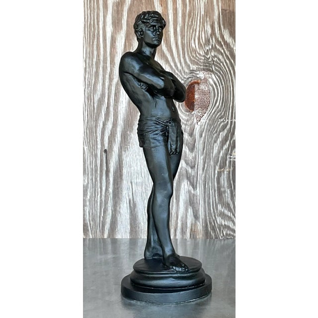 This vintage boho plaster statue of a man exudes a unique charm with its eclectic and artistic design. The sculpture's...