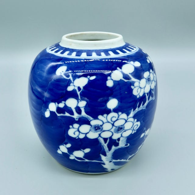 Antique Chinese blue and white prunus ginger jar with hand-painted decoration on a cracked ice ground, in the Kangxi...