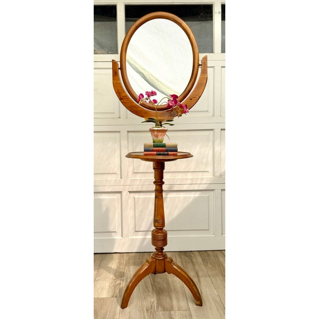 Here is an antique cheval dressing mirror dating to the late 19th or early 20th century, with a beautifully turned wood...