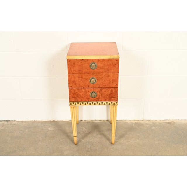 A beautiful French Regency Louis XVI or Neoclassical style three-drawer nightstand In the manner of Romweber By Union...
