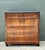This striking bachelor’s chest draws inspiration from the refined minimalism and architectural grace of the Neoclassical...
