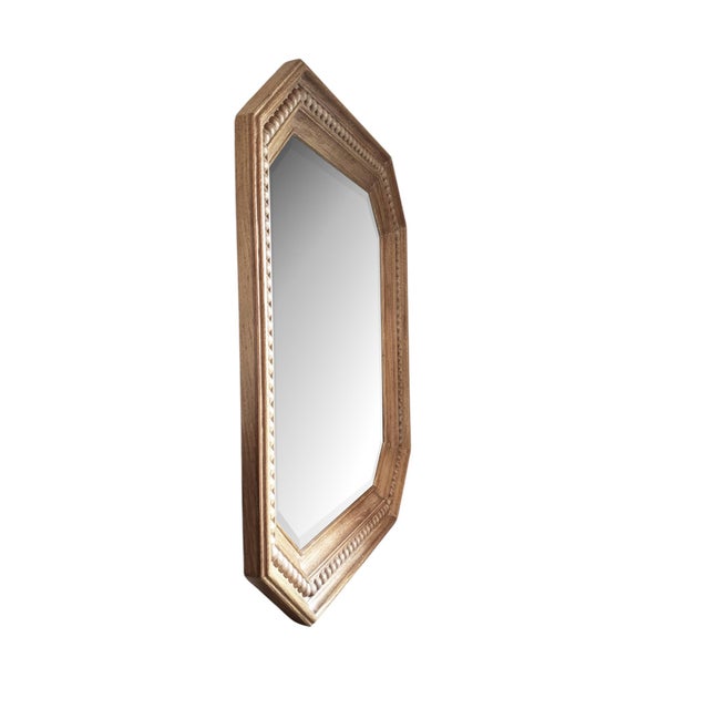 A beautiful octagonal wood mirror with a thick chunky stacked molded frame. The cerused-oak finish creates a soft neutral...
