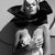 Opium by Dasha and Mari Strike a pose, a fashion model poses with a white rose. Limited edition print (edition size 1/30)...