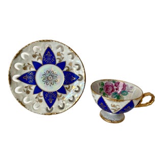 Vintage Ucagco Ceramics Japan Porcelain Teacup and Saucer Set Cobalt Blue Pink Rose Lusterware Pierced Scalloped Rim Mid-Century Excellent Condition For Sale