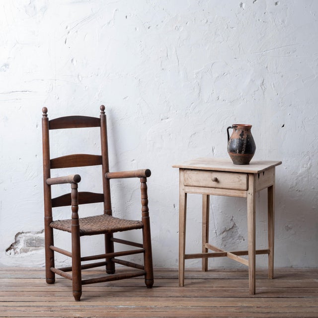 A bleached mahogany one drawer side table with cross stretcher, 18th century. 19 ¼ inches wide by 16 ¾ inches deep by 26 ½...