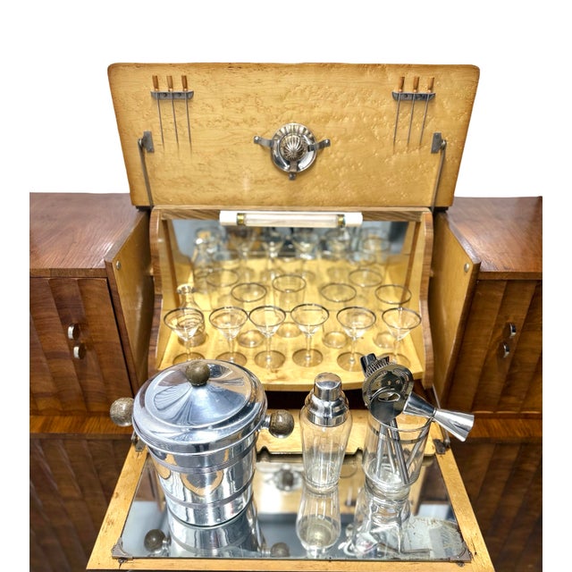 Stunning original 1930s Art Deco bar cabinet with a classic stepped, two-tier design. An English fluted burr walnut...