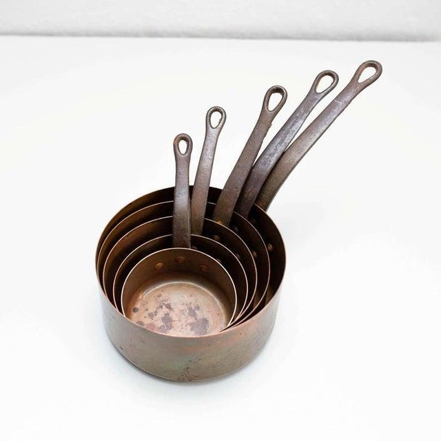 "Set of Five Hand Painted Brass Pots, circa 1960" Origin: Spain, circa 1960 Material: Brass Enhance your decor with this...