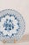 Pair of antique German reticulated plates featuring pierced borders, hand-painted blue and white decoration, and scalloped...