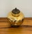 Handcrafted Maitland-Smith lidded decorative jar featuring a bulbous polished brass body with a warm, lightly mottled...