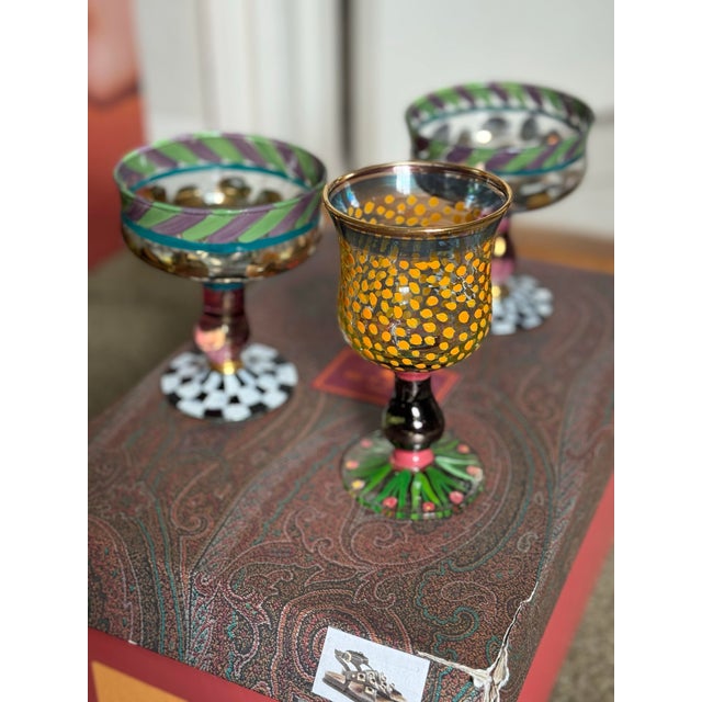 Three 1990s Mackenzie Childs Glasses: Champagne Glasses (A Pair) and MacKenzie Childs Piccadilly Circus Water Goblet...