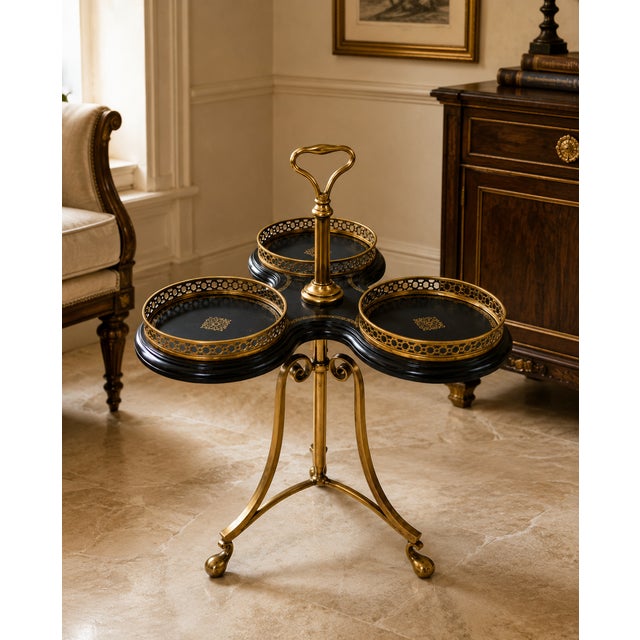 A distinctive vintage Maitland-Smith trefold side table featuring three circular black tooled-leather surfaces arranged in...