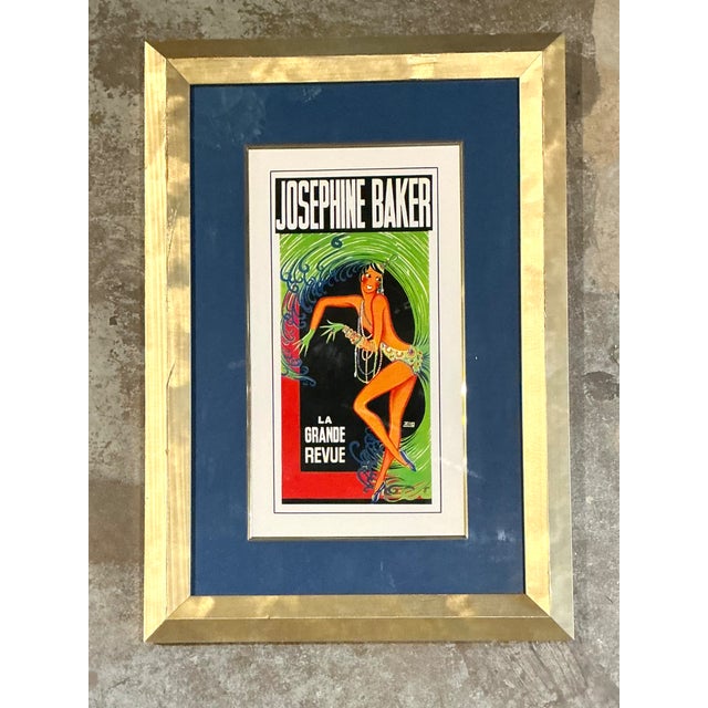 Description: This striking vintage framed print of “La Grande Revue” featuring the legendary Josephine Baker captures the...
