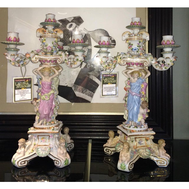 Pair of porcelain candelabras with angels and flowers, extremely detailed and colorful. Porcelain, from Germany. The mark...