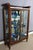 Mahogany display case opening with two doors from the end of the 19th century. This display case has a glass bottom, the...