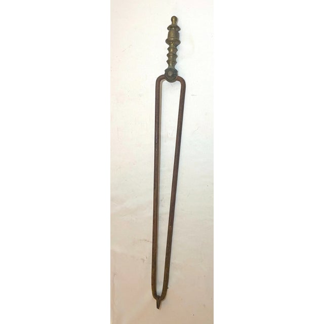 Up for sale is a nice pair of rare antique 18th century wrought iron and brass English fireplace tongs. The arms are...
