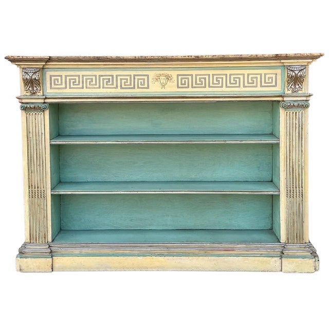 This is an early 20th century hand painted Venetian bookshelf. The piece has elements of neo-classicsm and a faux marble...