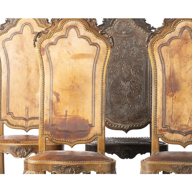 Set of five high-backed chairs - 19th century. Portuguese; 19th century in chestnut wood; with embossed leather and...