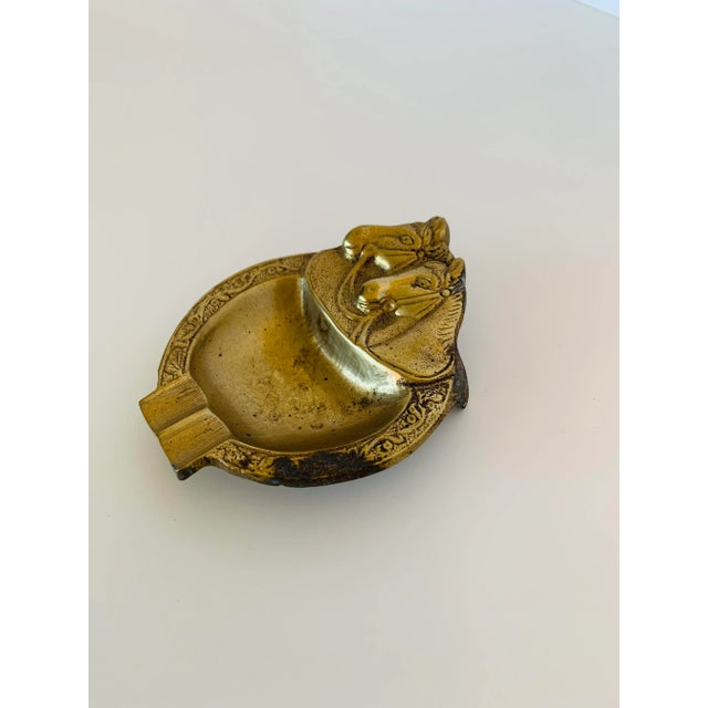 This ashtray was purchased in the Middle East in the early 1980s. It depicts a pair of well-satisfied looking horses. It...