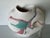 An expressive 1980s vintage ceramic vase inspired by Southwestern Native American art, featuring a sculptural organic form...