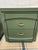 Pair of vintage nightstands painted professionally in a smooth, matte olive green finish.Each unit features a blocky, mid-...
