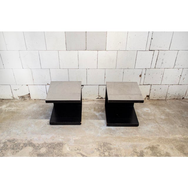 Pair of bedside tables with lacquered wood frame, metal tops and feet. Designer: Studio OPI Manufacturer: Cini & Nils...