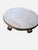 An elegant vintage Portuguese coffee table featuring a substantial round Rosa Aurora marble top resting on an ornately...