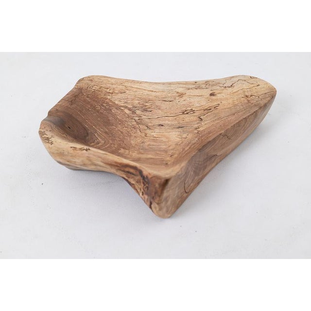 This graceful, organic bowl is a one of a kind piece, hand carved from a single block of figured solid hardwood. Its...