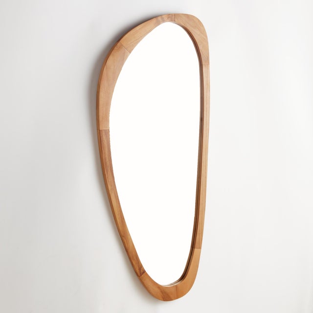 This well scaled mirror is framed with a teak wood. A beautiful grain with a smooth, honed finish. With it, s unique...