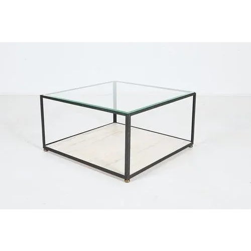 Architectural square coffee table from 1960’s produced in Italy. Features black coated steel base with brass feet caps,...